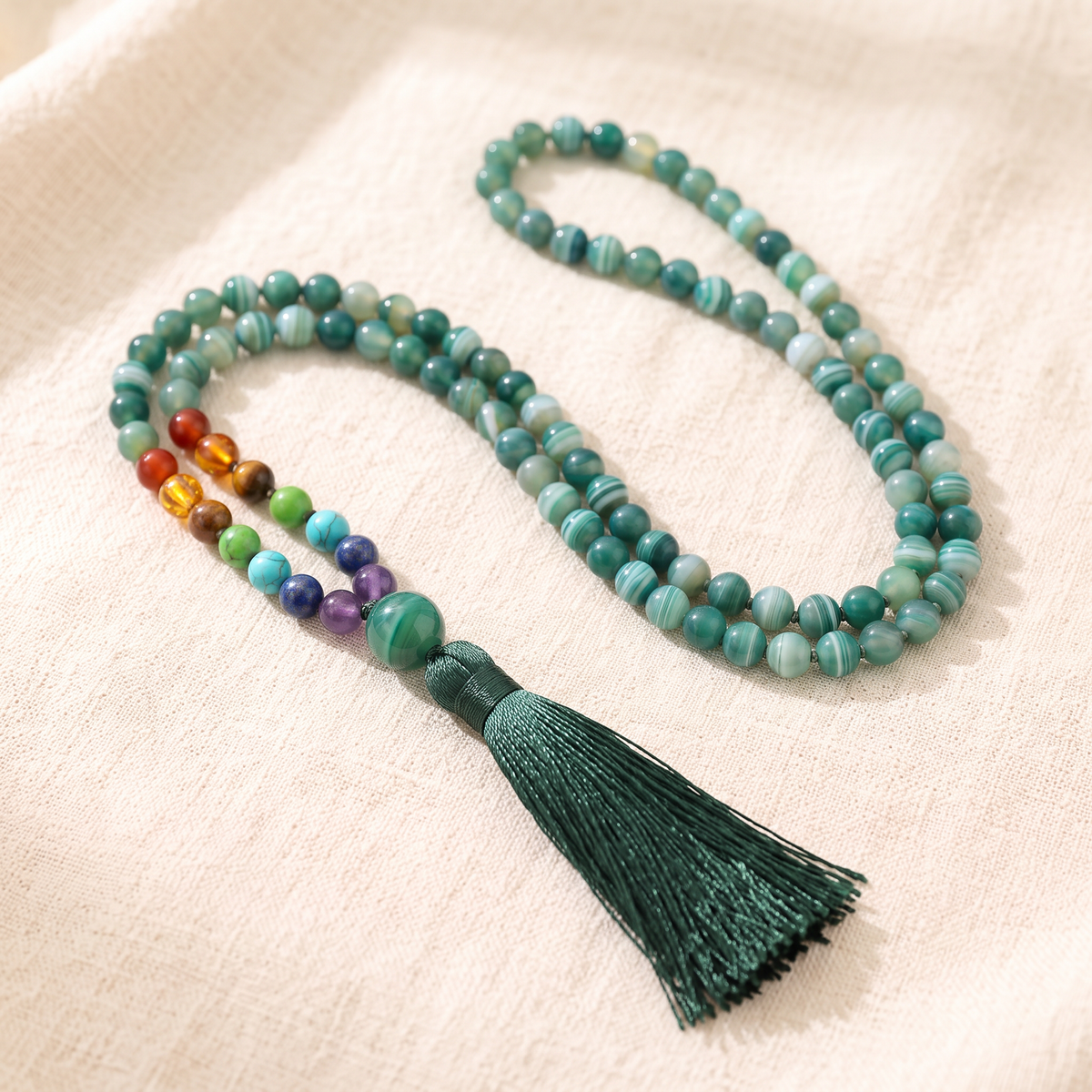 Sea Green Agate 7 Chakra Mala Necklace on cream linen