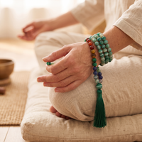Sea Green Agate mala wrapped around the wrist in meditation