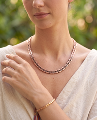 Woman wearing the Copper Shield Magnetic Necklace