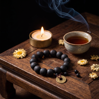 The Buddha Mala Bracelet with candlelight, tea and incense